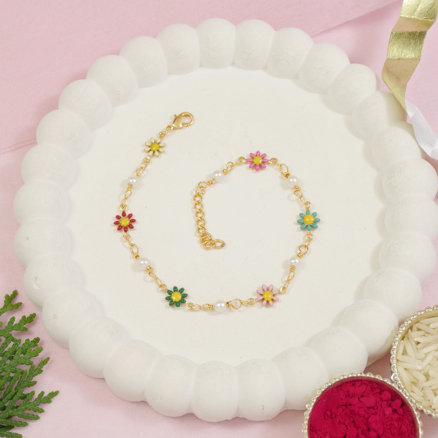 Delicate gold floral bracelet with pearls for Raksha Bandhan
