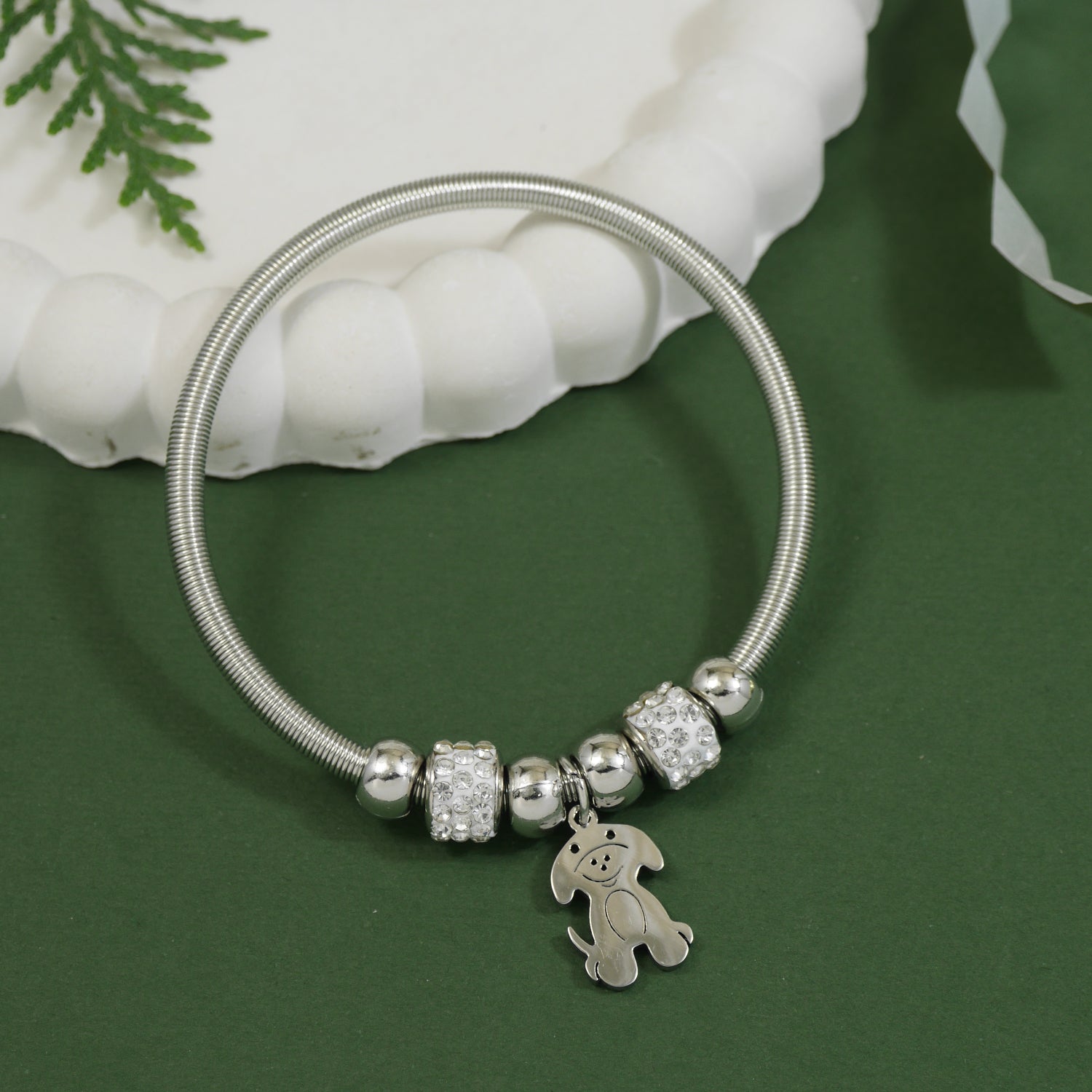 Adorable silver bracelet with crystal beads and a hanging puppy charm pendant
