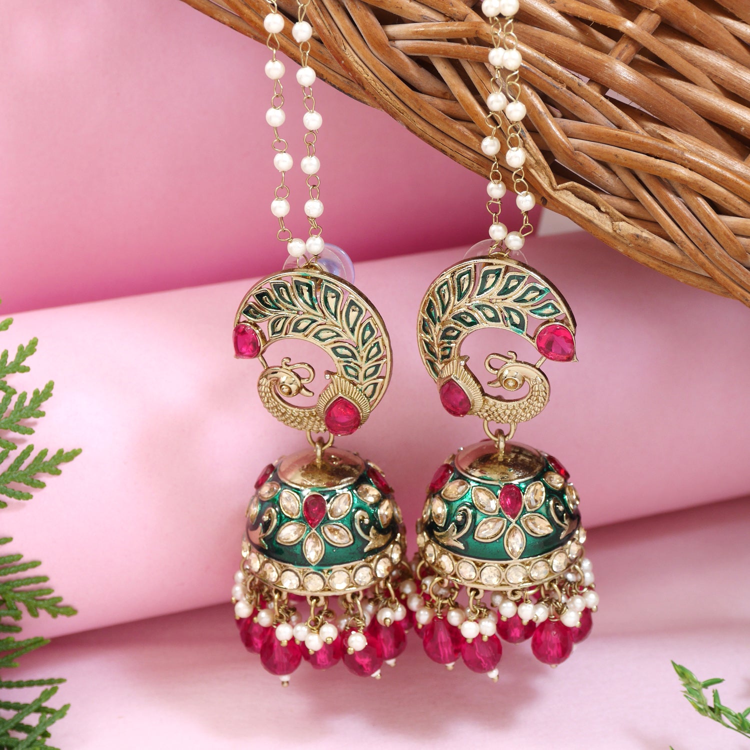 Peacock design kundan jhumka earrings with enamel work, pink beads, and pearl hangings