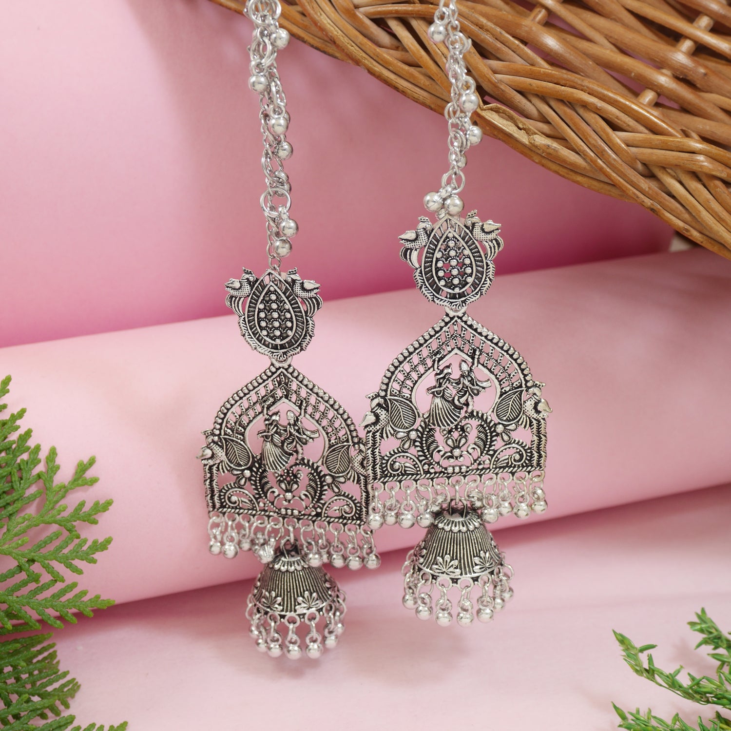 Oxidized silver jhumka earrings with peacock design, filigree work, boho navratri ghungroos, and detachable ear chain