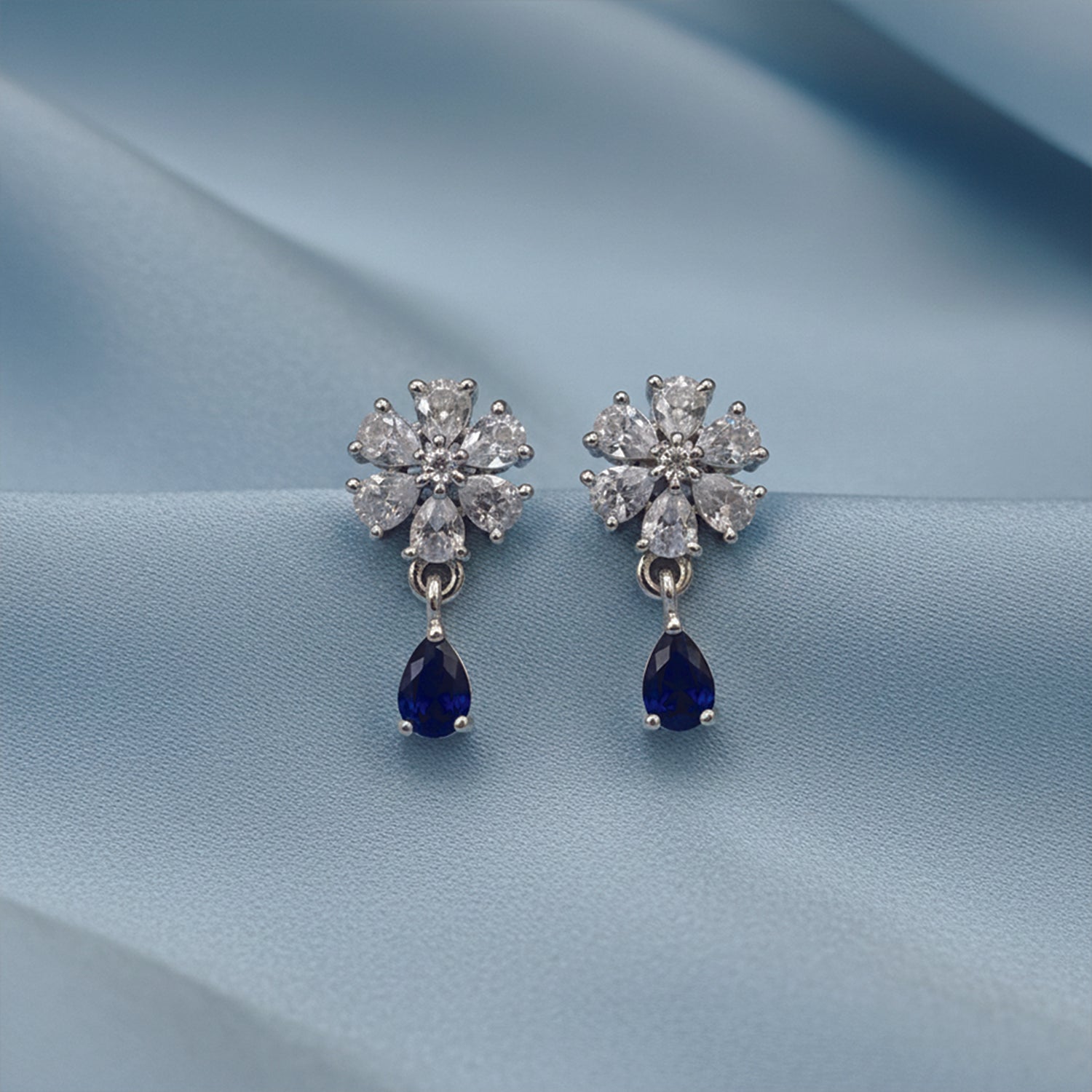 Elara- Blue Teardrop Floral Stud Earrings in Silver Finish