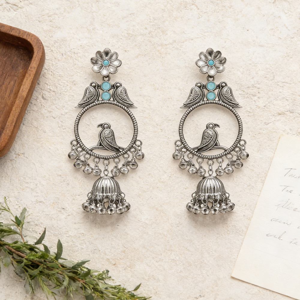 Anukriti- Oxidised Bird Motif Jhumka Earrings with Blue Stone