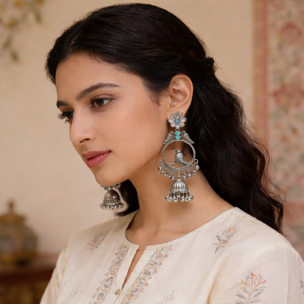 Anukriti- Oxidised Bird Motif Jhumka Earrings with Blue Stone