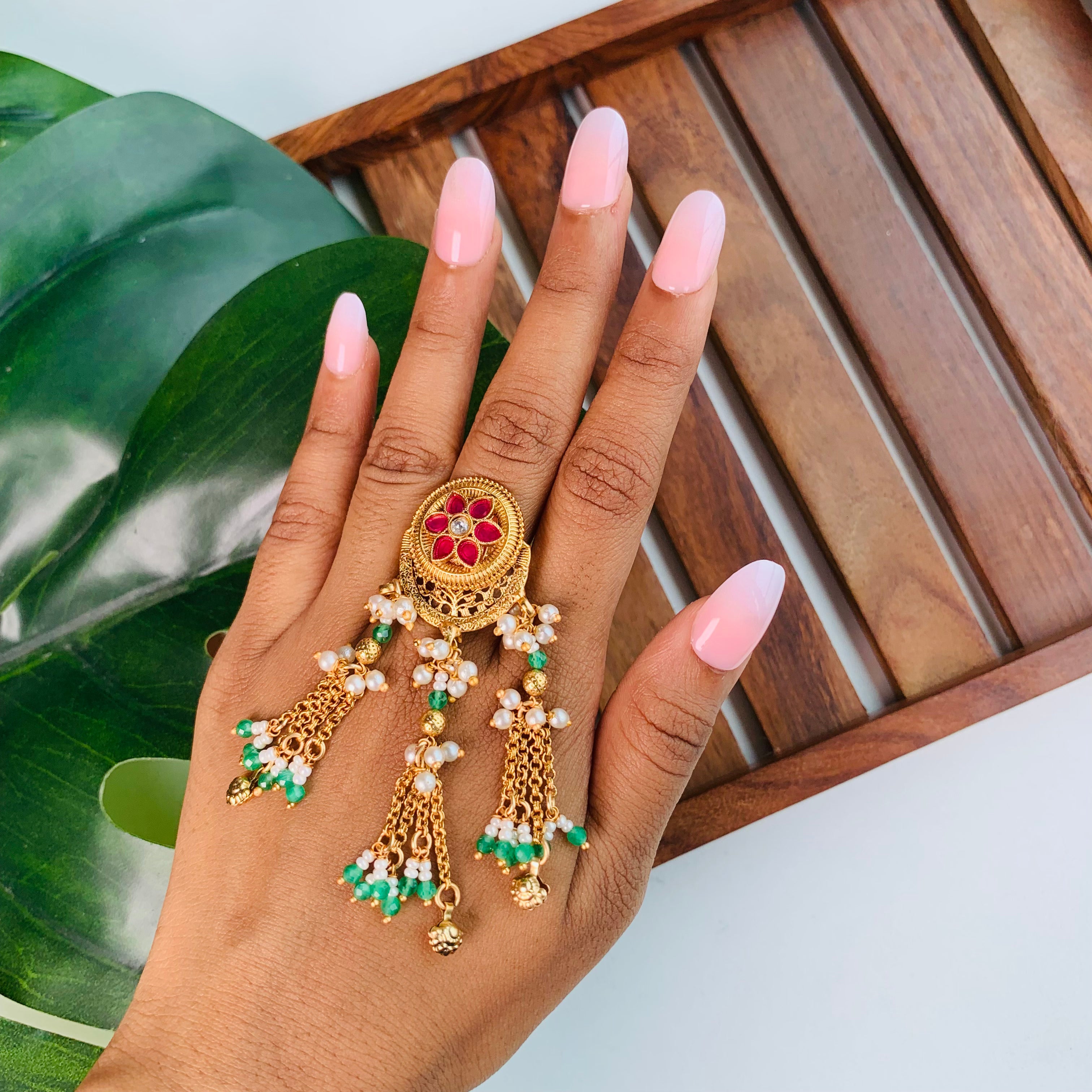 Red-green kundan ring with pearl drop chains – trending kundan finger ring for mehendi, haldi, and Indian festival styling
