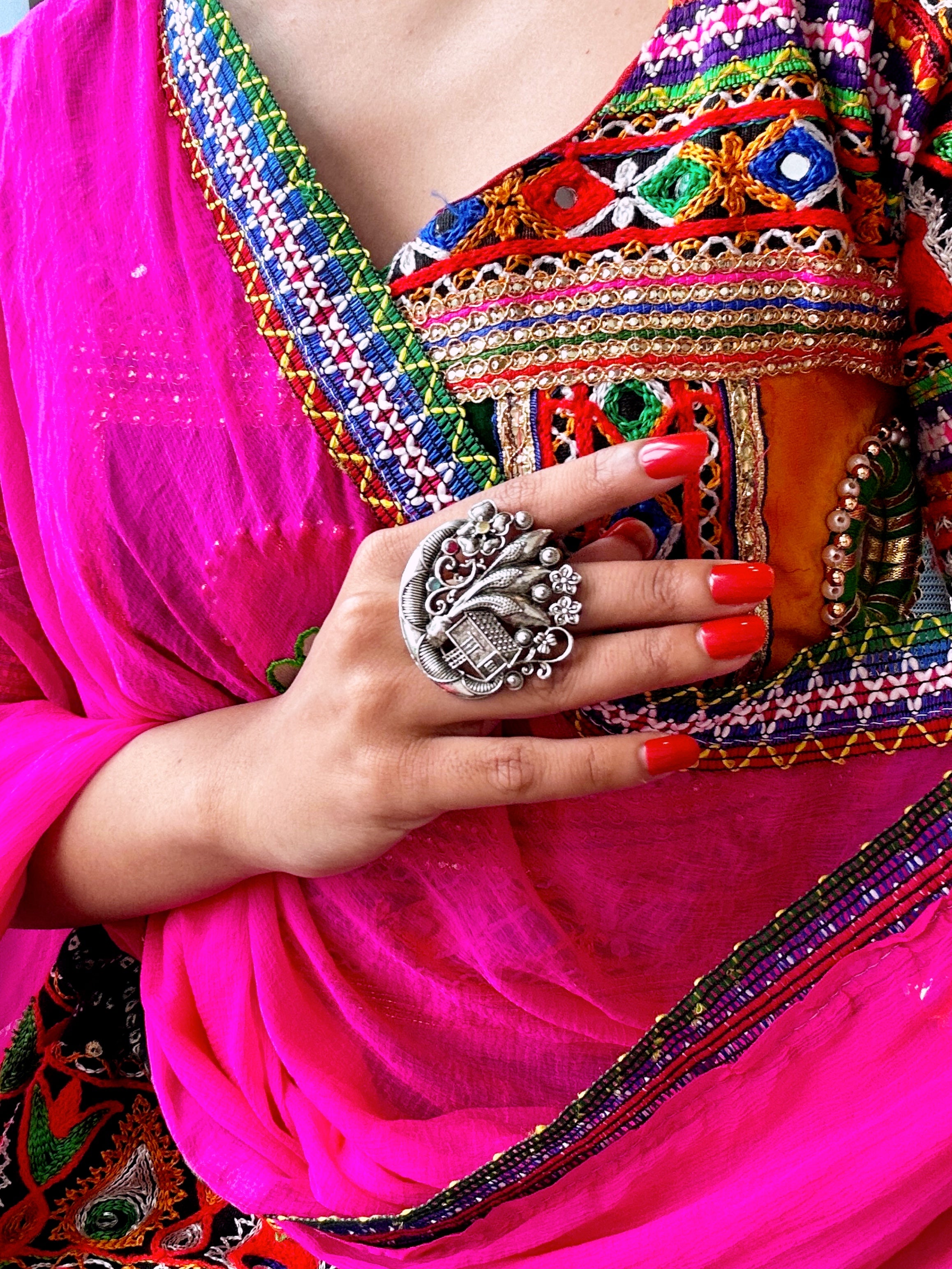 Oxidised peacock kada ring with spiral design and red stone for women’s Navratri jewellery