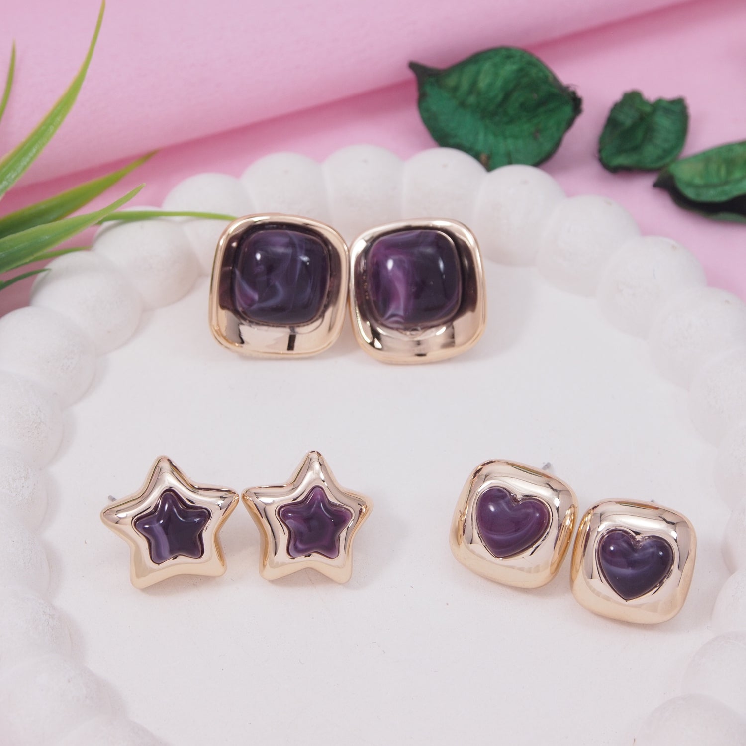 earring set with violet enamel heart, star, and square-shaped gold-toned stud earrings