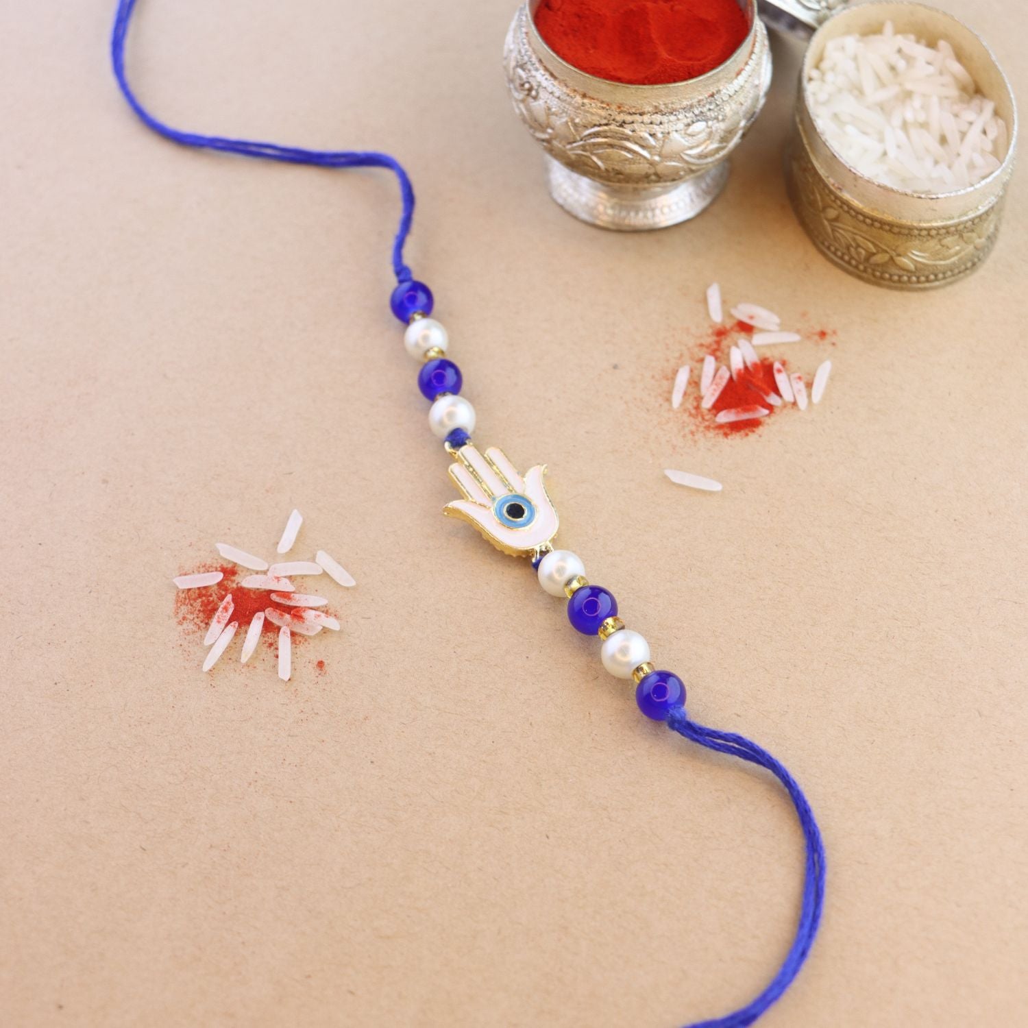 Hamsa Shape Enamel Bhaiya Rakhi With Roli Chawal & Card