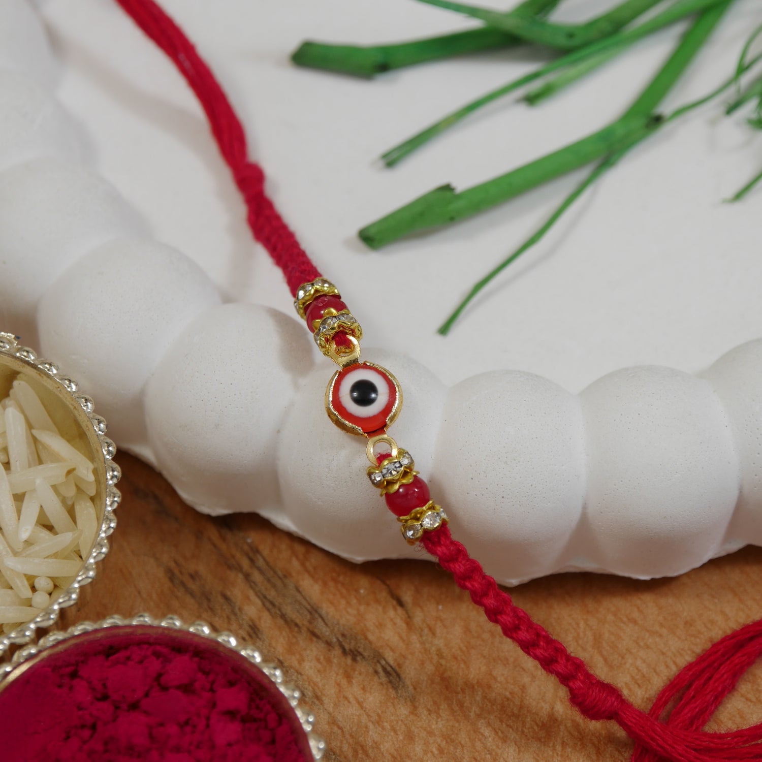 Minimalist Evil Eye Rakhis With Roli Chawal & Rakshabandhan Card (Pack of 2)