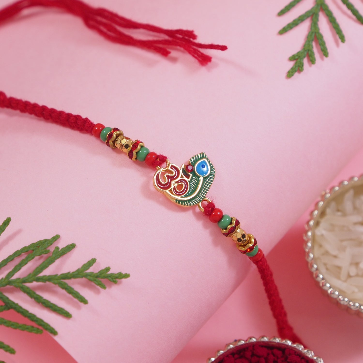 DELICATE PEARL BEADED ENAMEL RAKHI WITH ROLI CHAWAL & RAKSHABANDHAN CARD