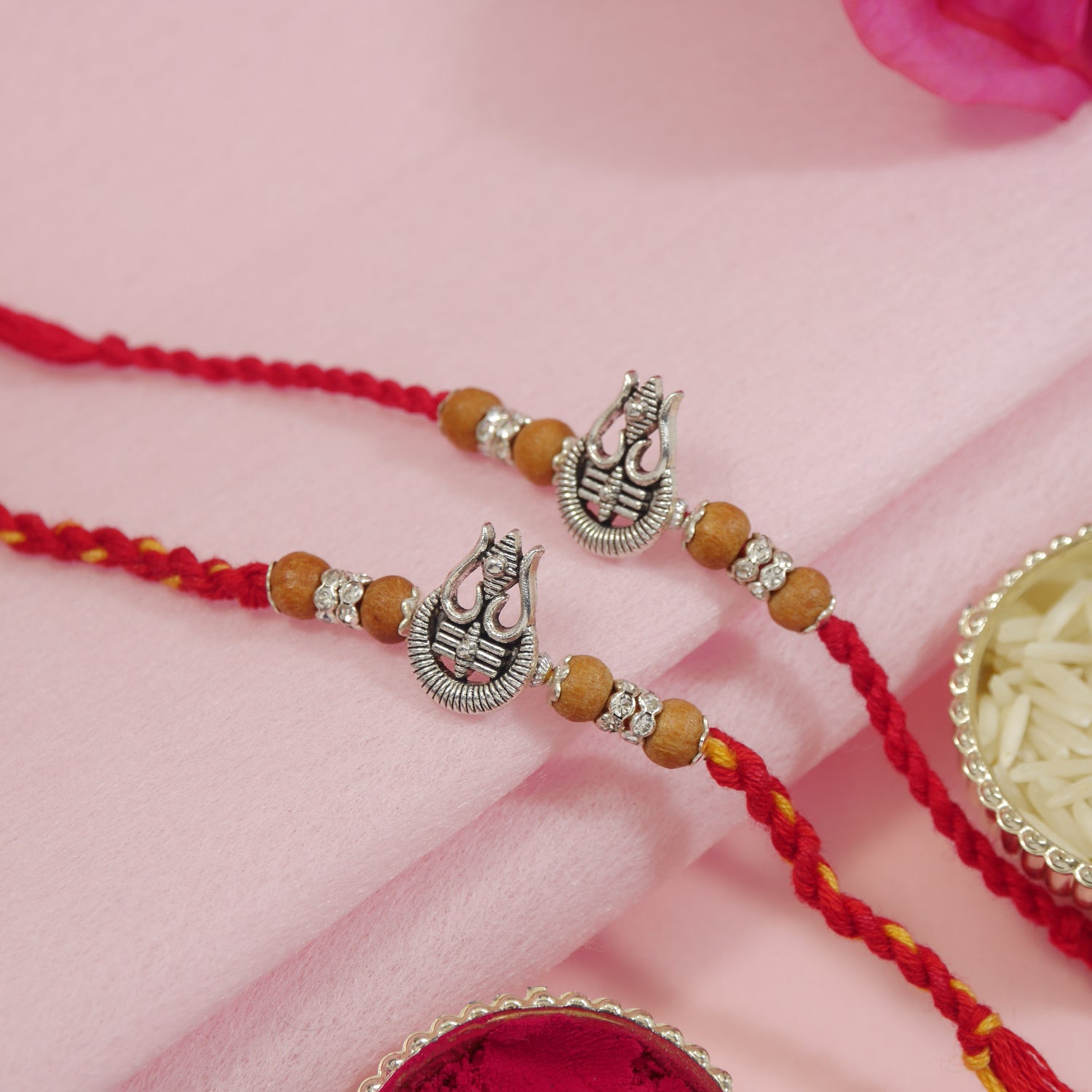 religious rakhi for bhai with trishul and red & yellow thread