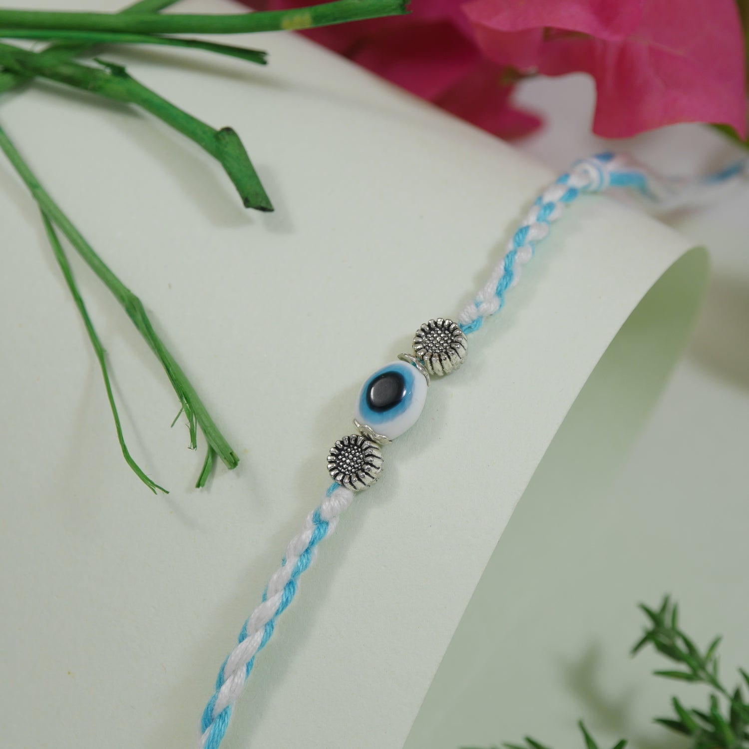 Evil Eye Floral Rakhi with Roli Chawal and Raksha Bandhan Card