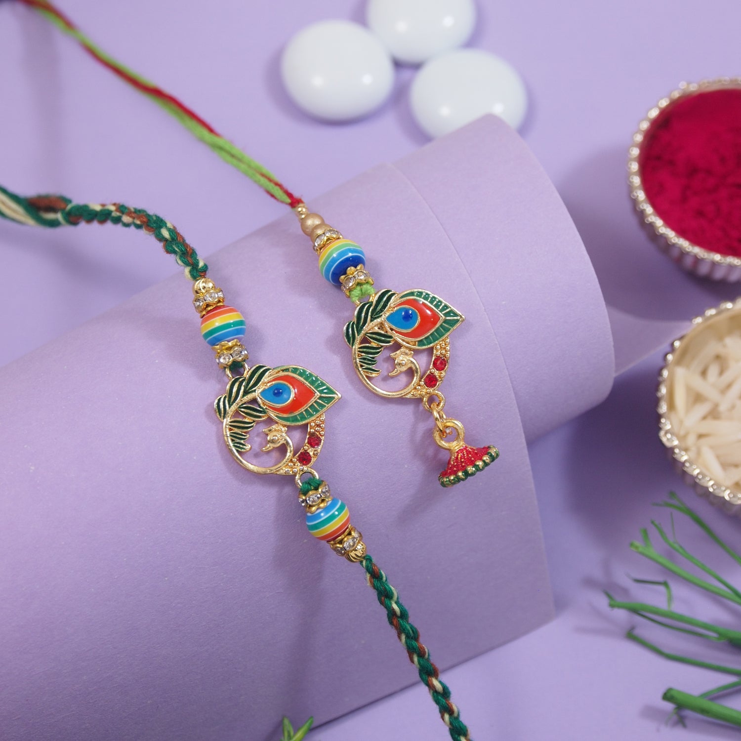 peacock rakhi bhaiya bhabhi set with feather motif and roli chawal