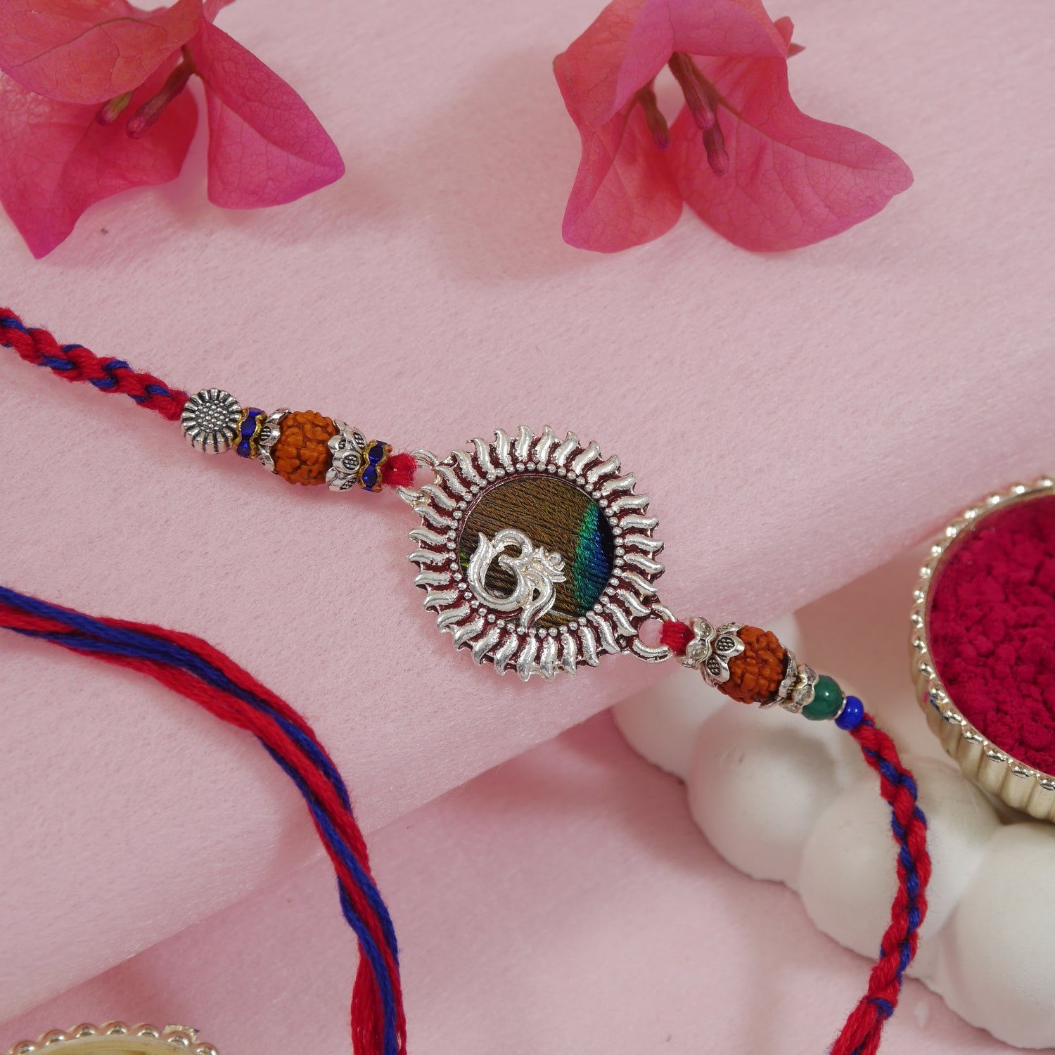 Religious OM rakhi for bhai with peacock feather