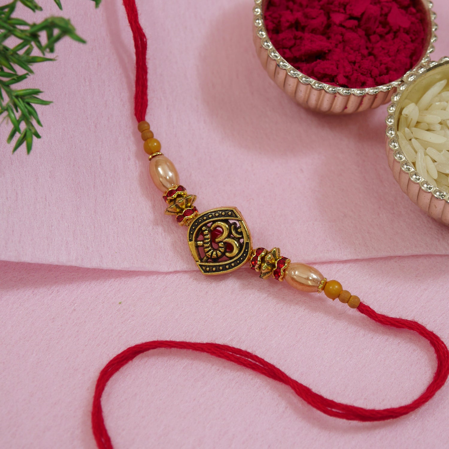 Antique OM Rakhi for Bhai with pearls & Red Thread
