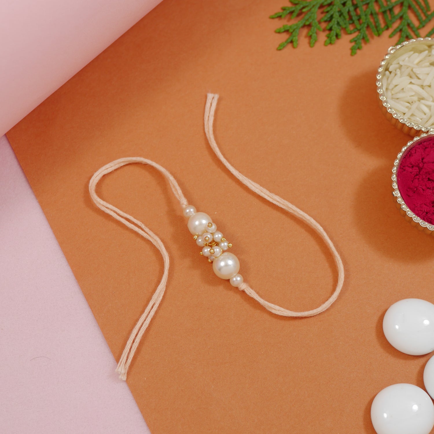 pearl & beads rakhi for bhai with peach thread
