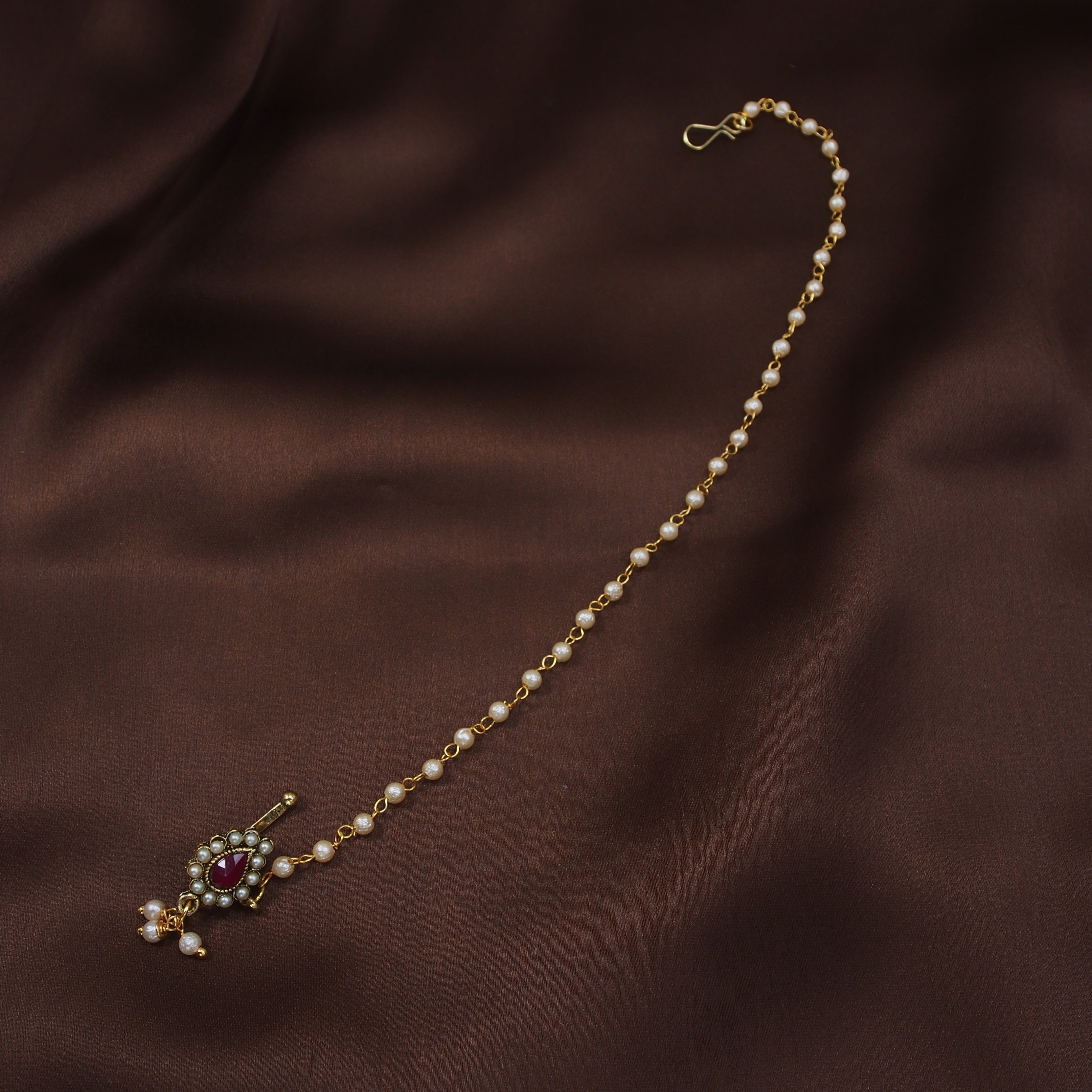 kundan , stones , pearls , chain nose ring