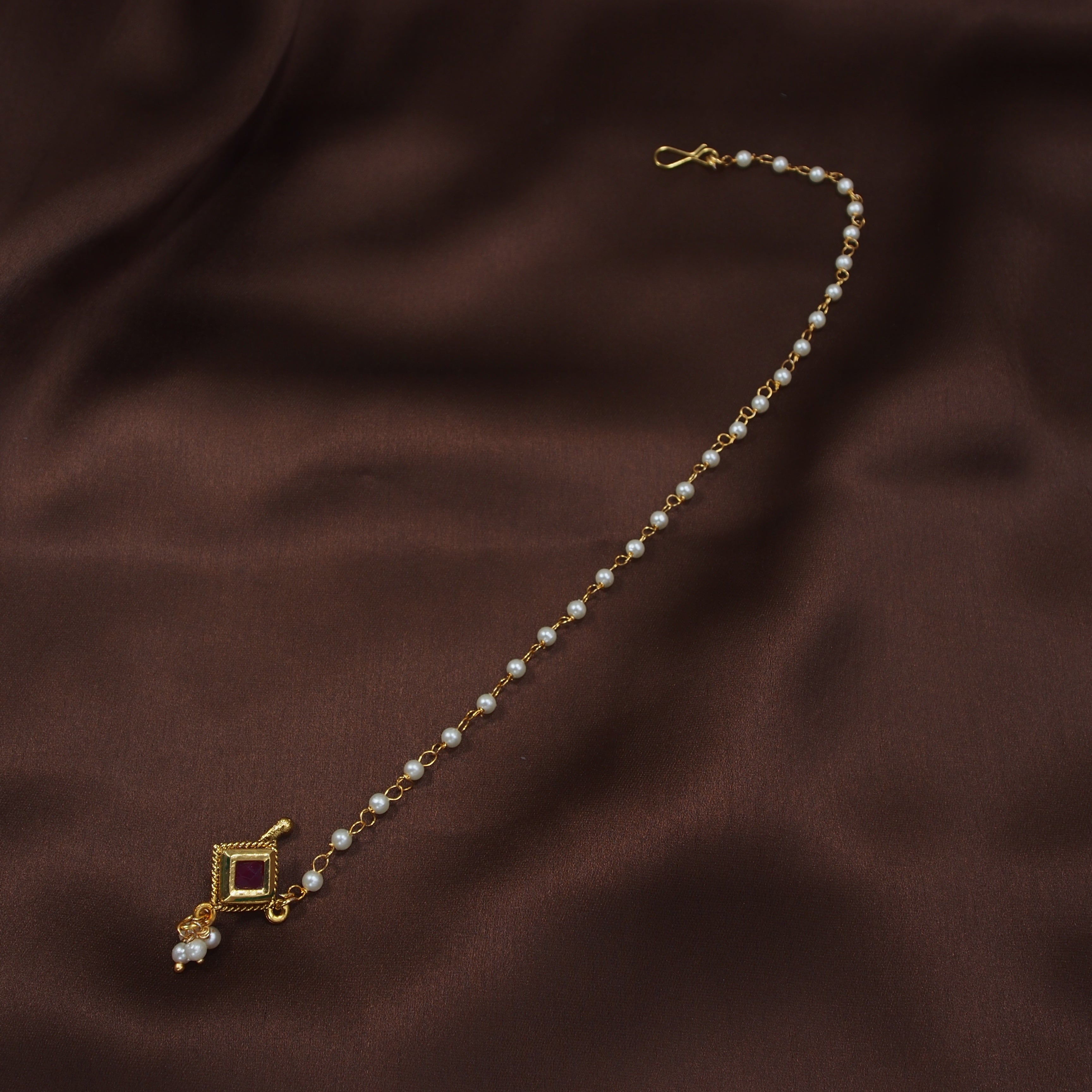 kundan , stones , pearls , chain nose ring