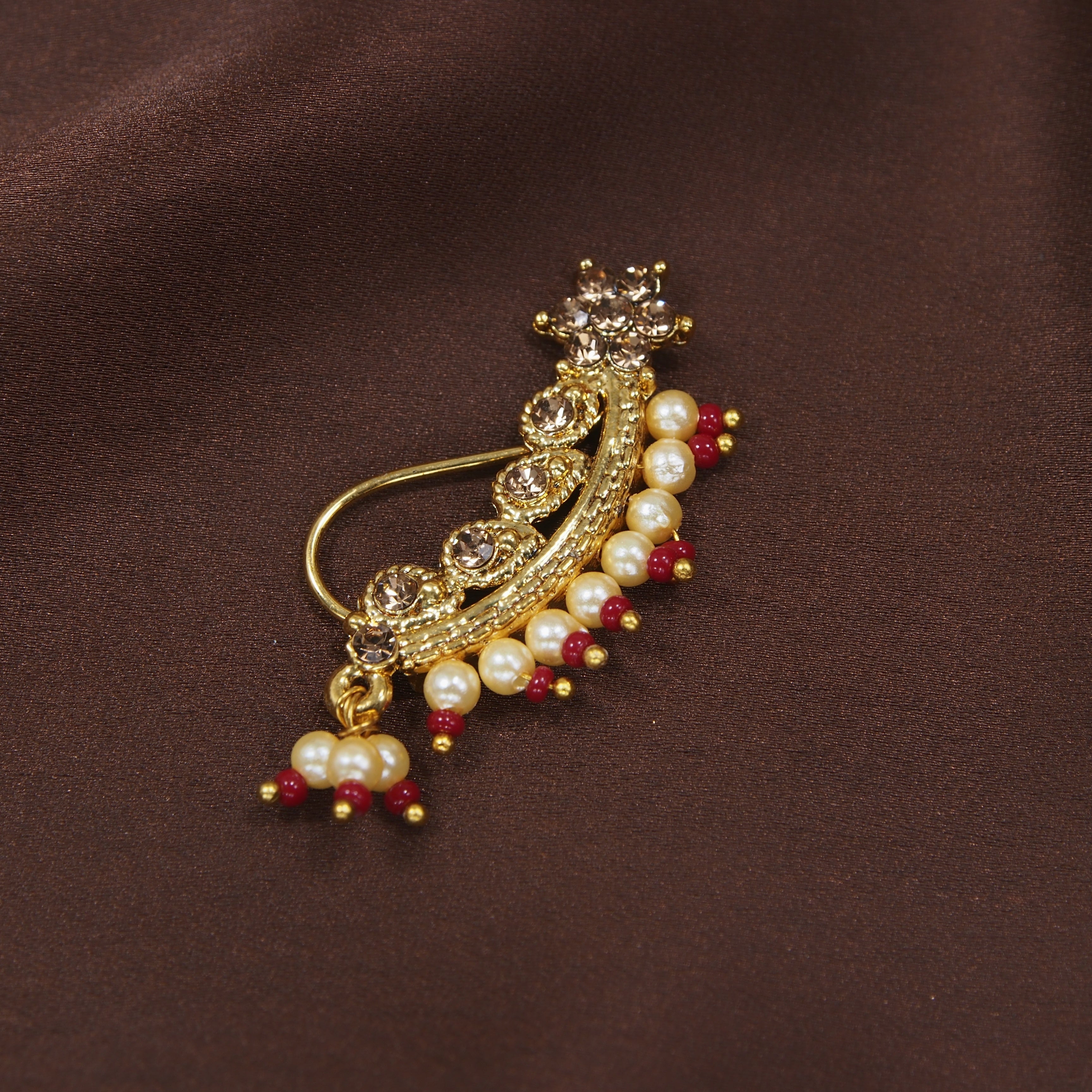 traditional stones , pearls , nose ring