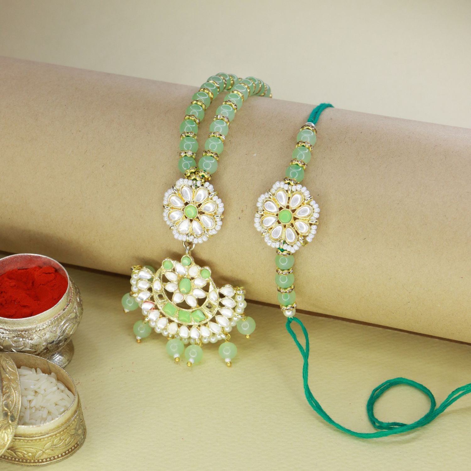 kundan , pearls ,stones ,lumba rakhi