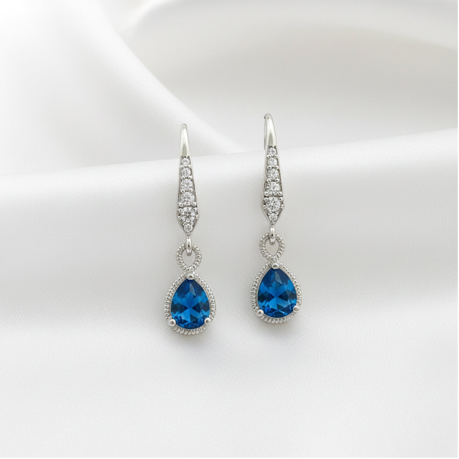 Isabel Tide Drops- Moody elegance with side shimmer.