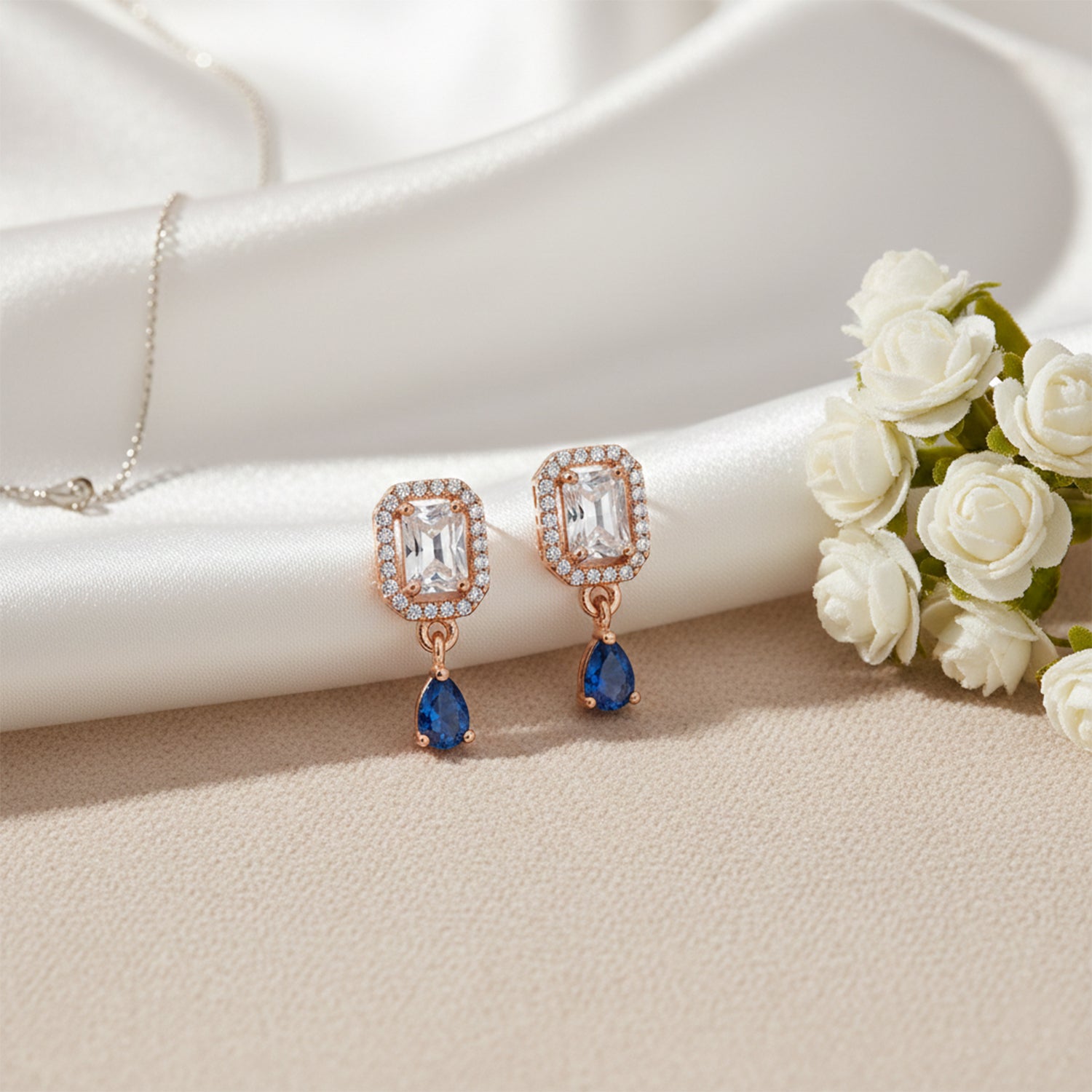 Clare- Blue Teardrop Stud Earrings in Rose Gold Finish