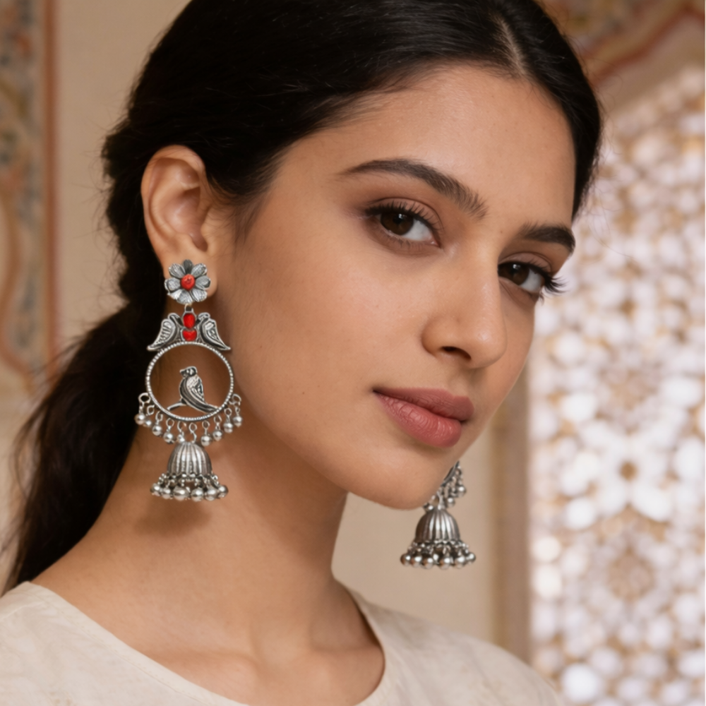 Anukriti- Oxidised Bird Motif Jhumka Earrings with Red Stone