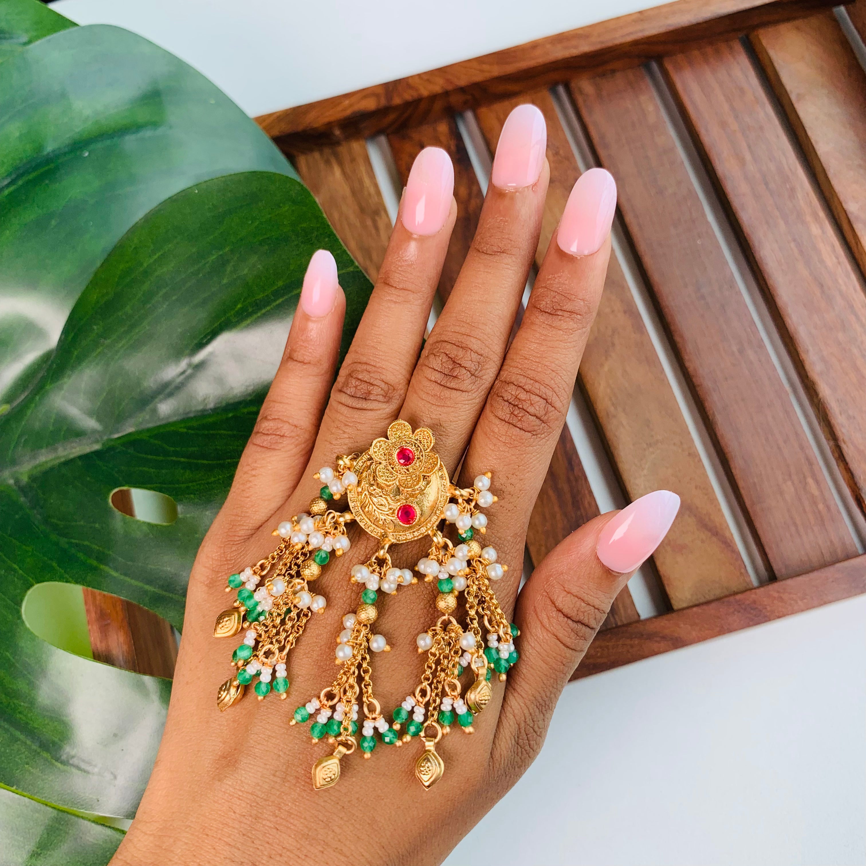 Heritage-style gold statement ring with mini coin charms and ruby accents – ideal Indian jewelry for navratri, wedding, and gifting.