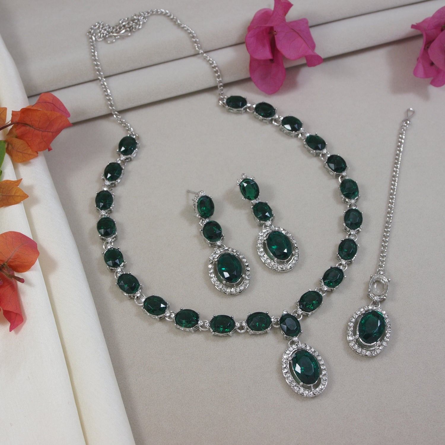 Emerald green jewelry set with necklace, earrings, silver long necklace