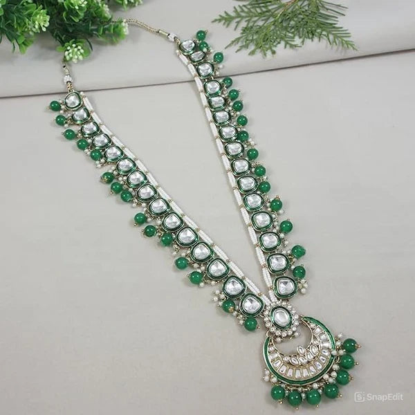 Long green kundan Ganpati mala with bead drops and crescent moon pendant.

