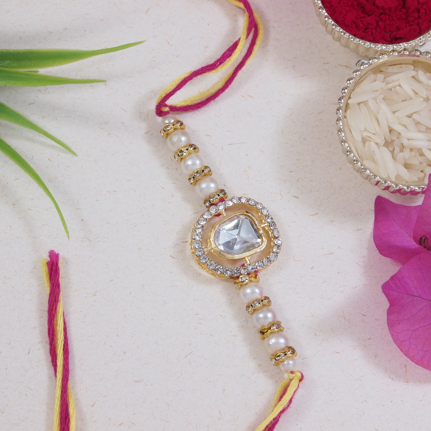 Dazzling Pearl Kundan Stone Rakhi with Roli Chawal & Card