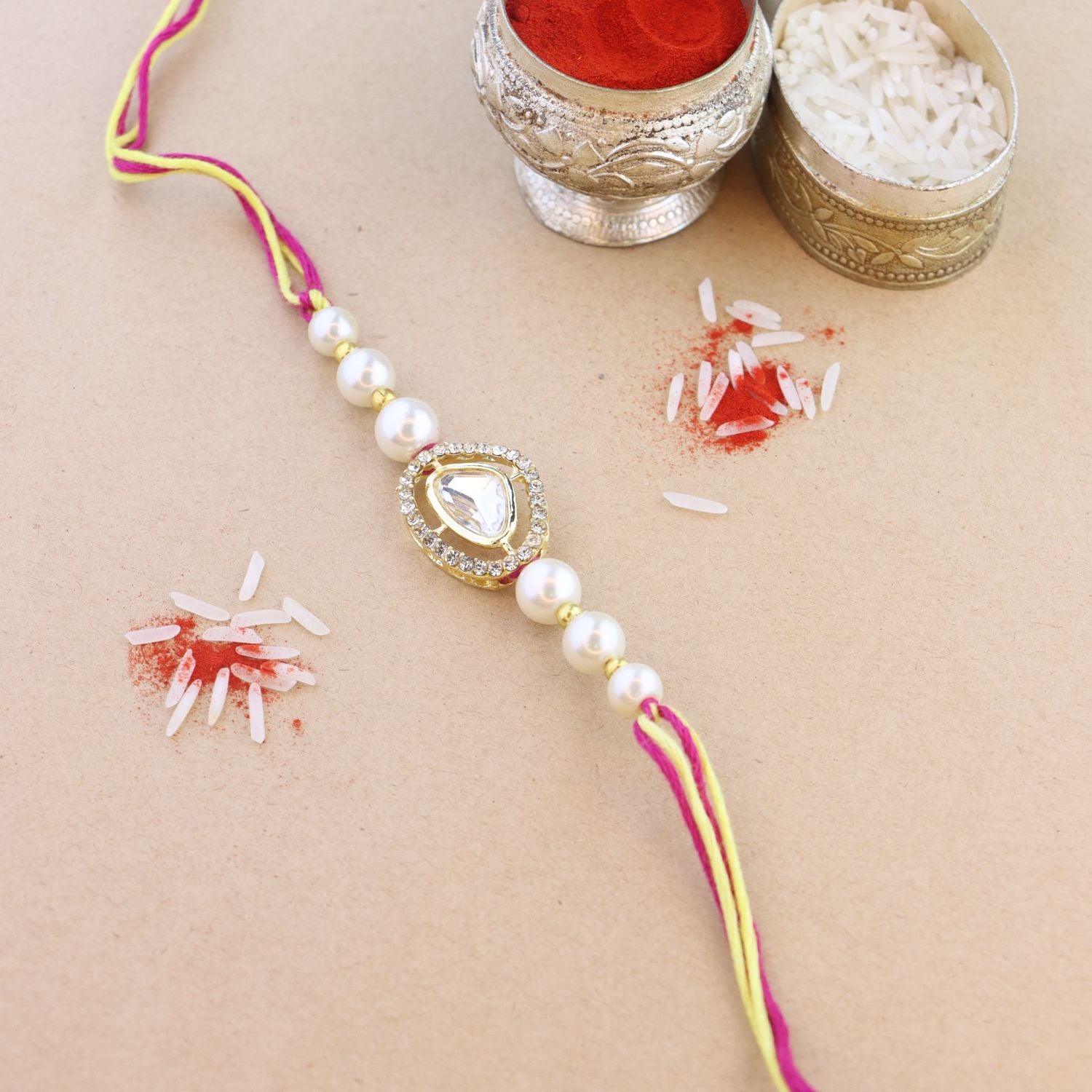 Dazzling Pearl Kundan Stone Rakhi with Roli Chawal & Card