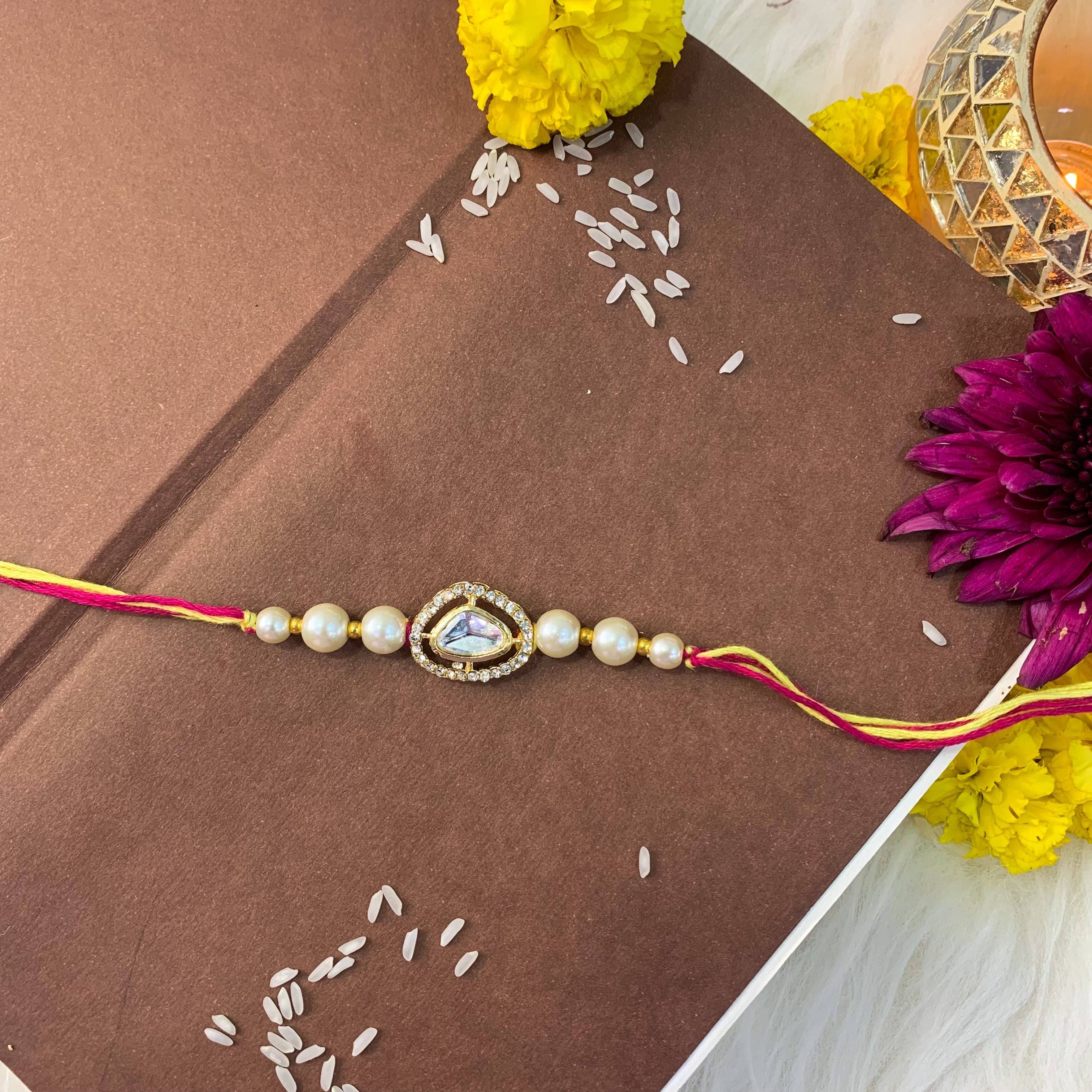 Dazzling Pearl Kundan Stone Rakhi with Roli Chawal & Card