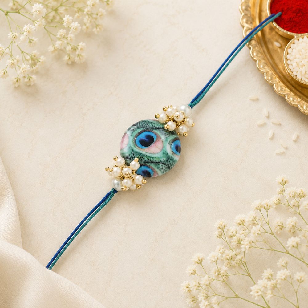Beautiful Peacock Feather Rakhi with Roli Chawal & Card
