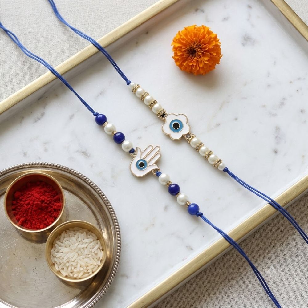 Floral and Hamsa Shape Enamel Bhaiya Rakhi With Roli Chawal & Card (Pack of 2)