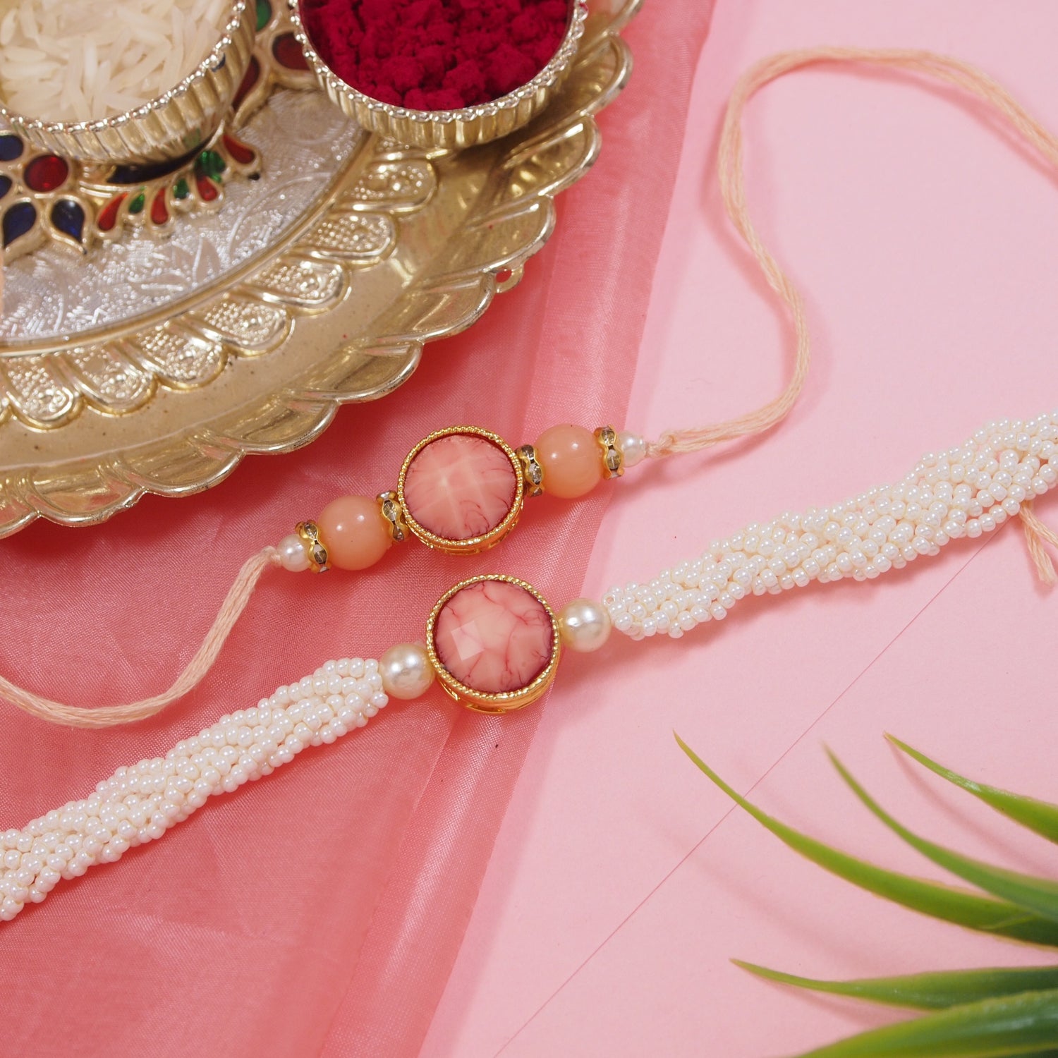 Elegant Bhaiya Bhabhi Peach Lumba Pearl & Rakhi With Roli Chawal &Card