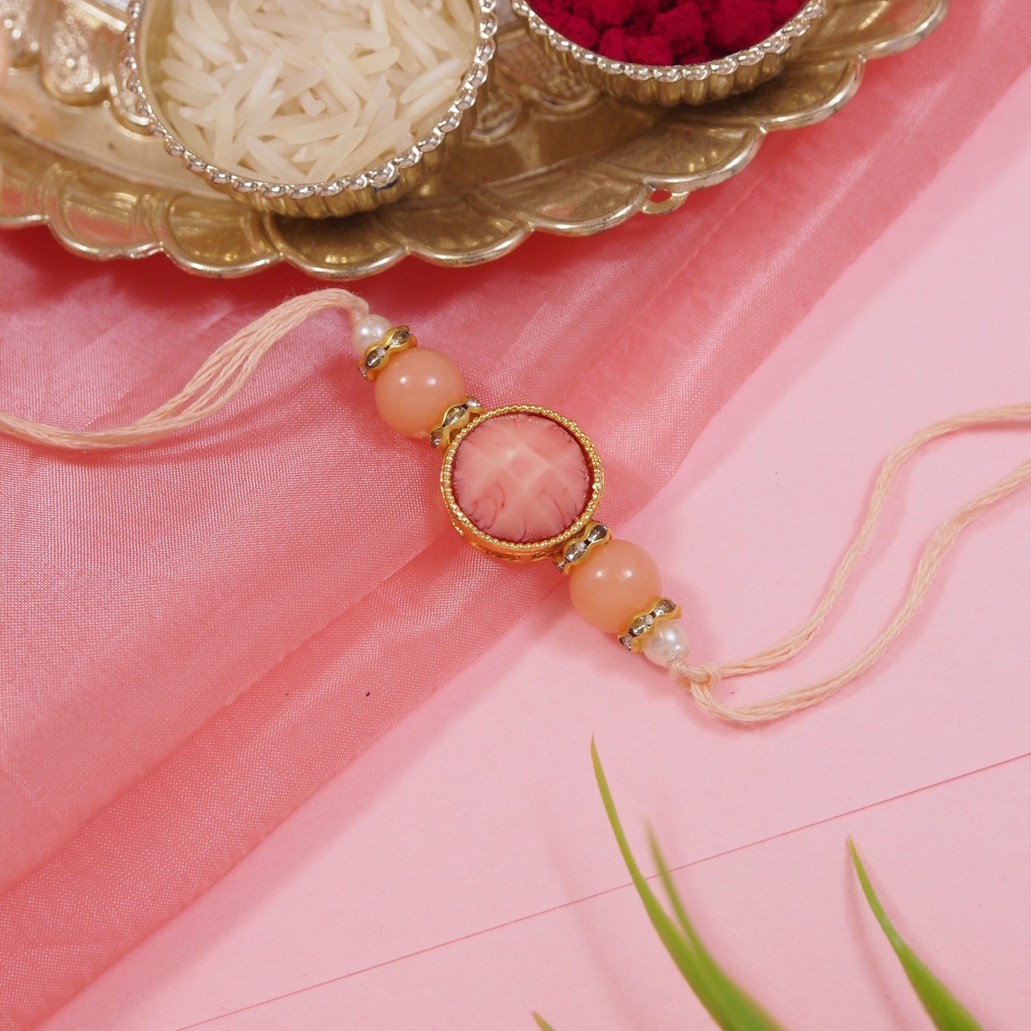 Delicate Pearl Beads Peach Rakhi with Roli Chawal & Rakshabandhan Card