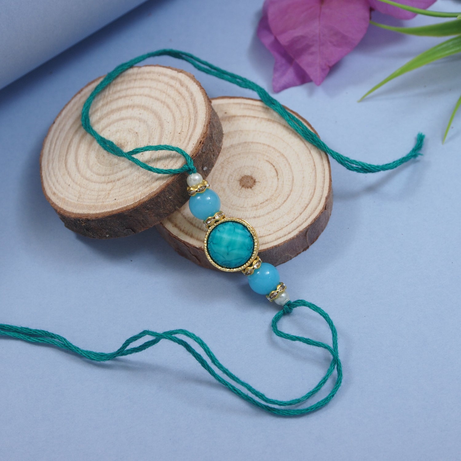 Delicate Pearl Beads Turquoise Rakhi with Roli Chawal & Rakshabandhan Card
