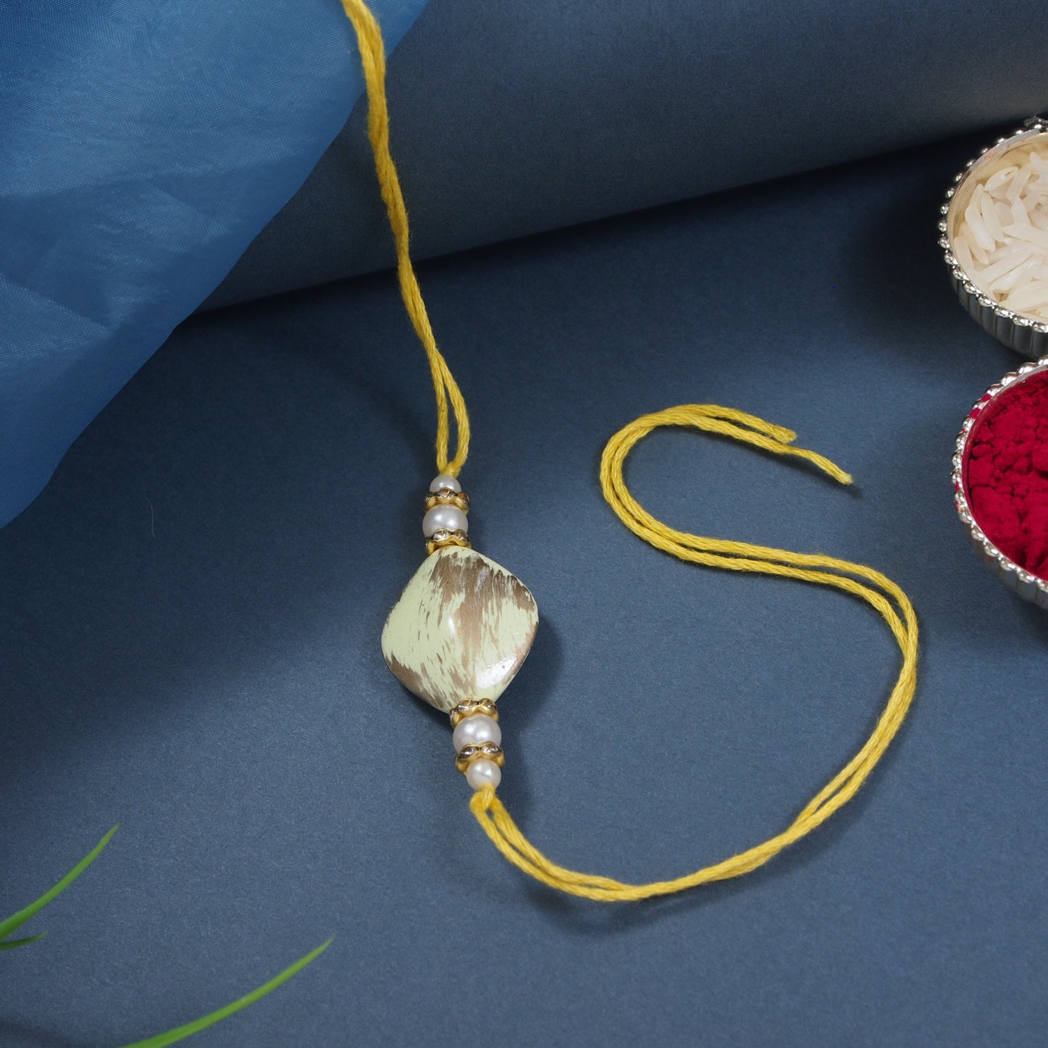 Delicate Pearl Beads Yellow Rakhi with Roli Chawal & Rakshabandhan Card