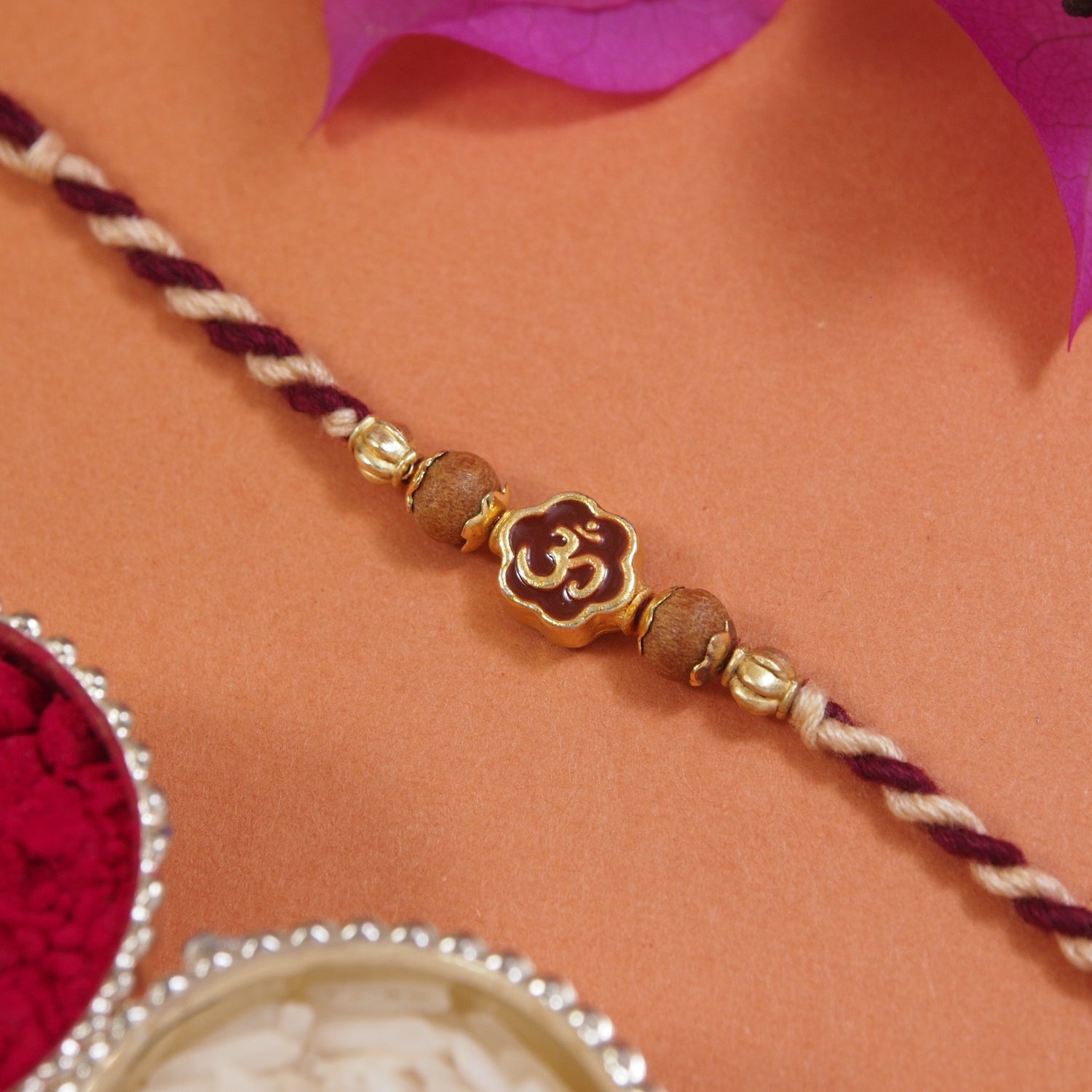 Om Maroon Enamel Pearl Beaded Rakhi