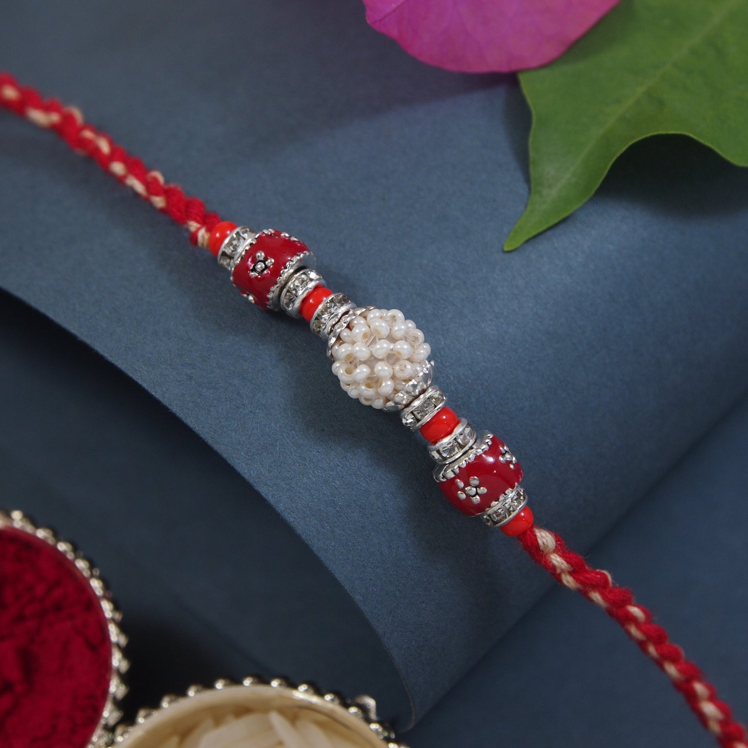 DELICATE PEARL BEADED Red RAKHI WITH ROLI CHAWAL & RAKSHABANDHAN CARD
