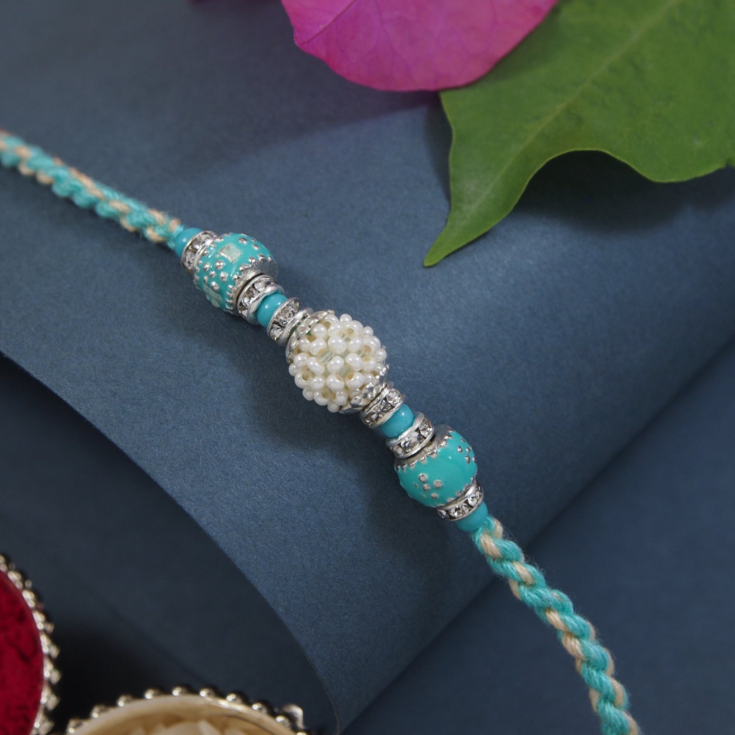 DELICATE PEARL BEADED Turquoise RAKHI WITH ROLI CHAWAL & RAKSHABANDHAN CARD