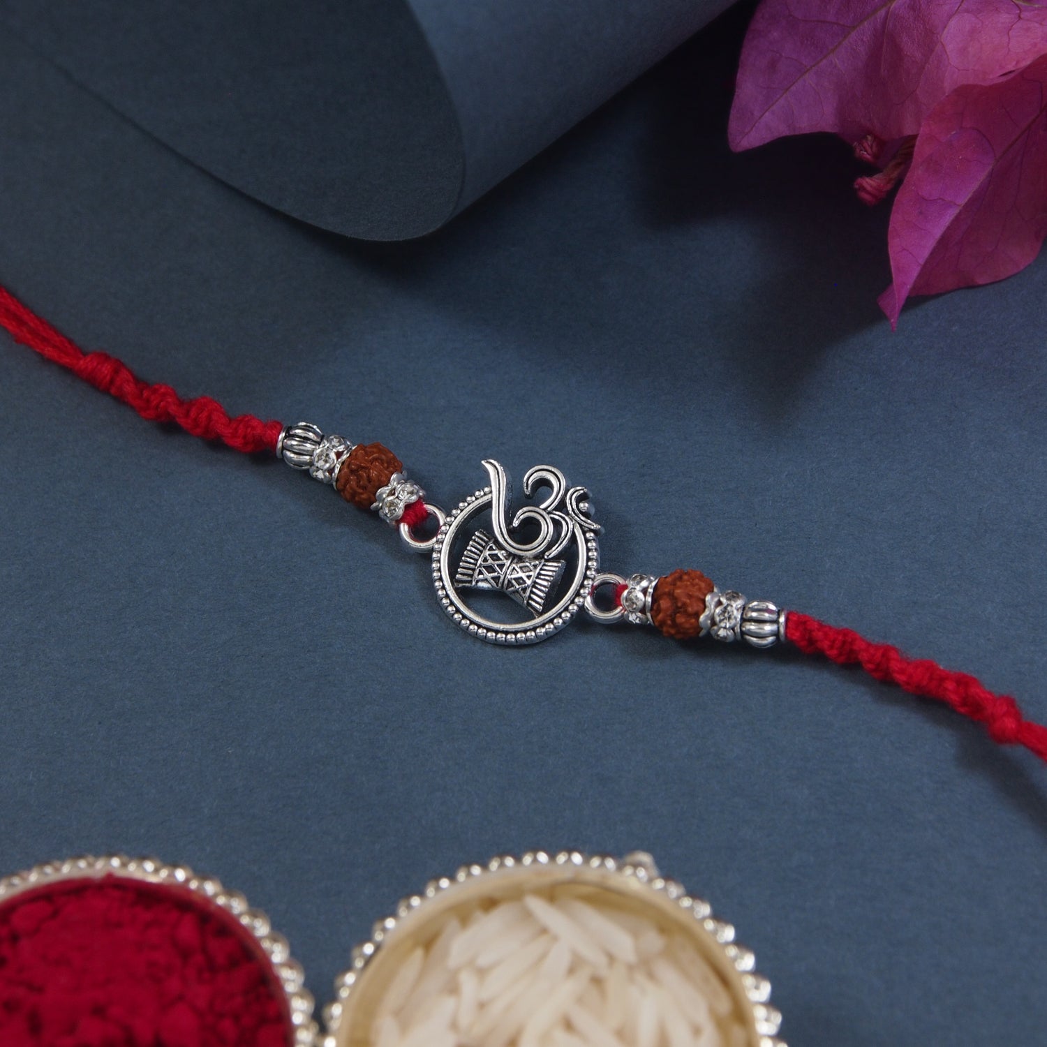 Om Damru Red Pearl Beaded Rakhi