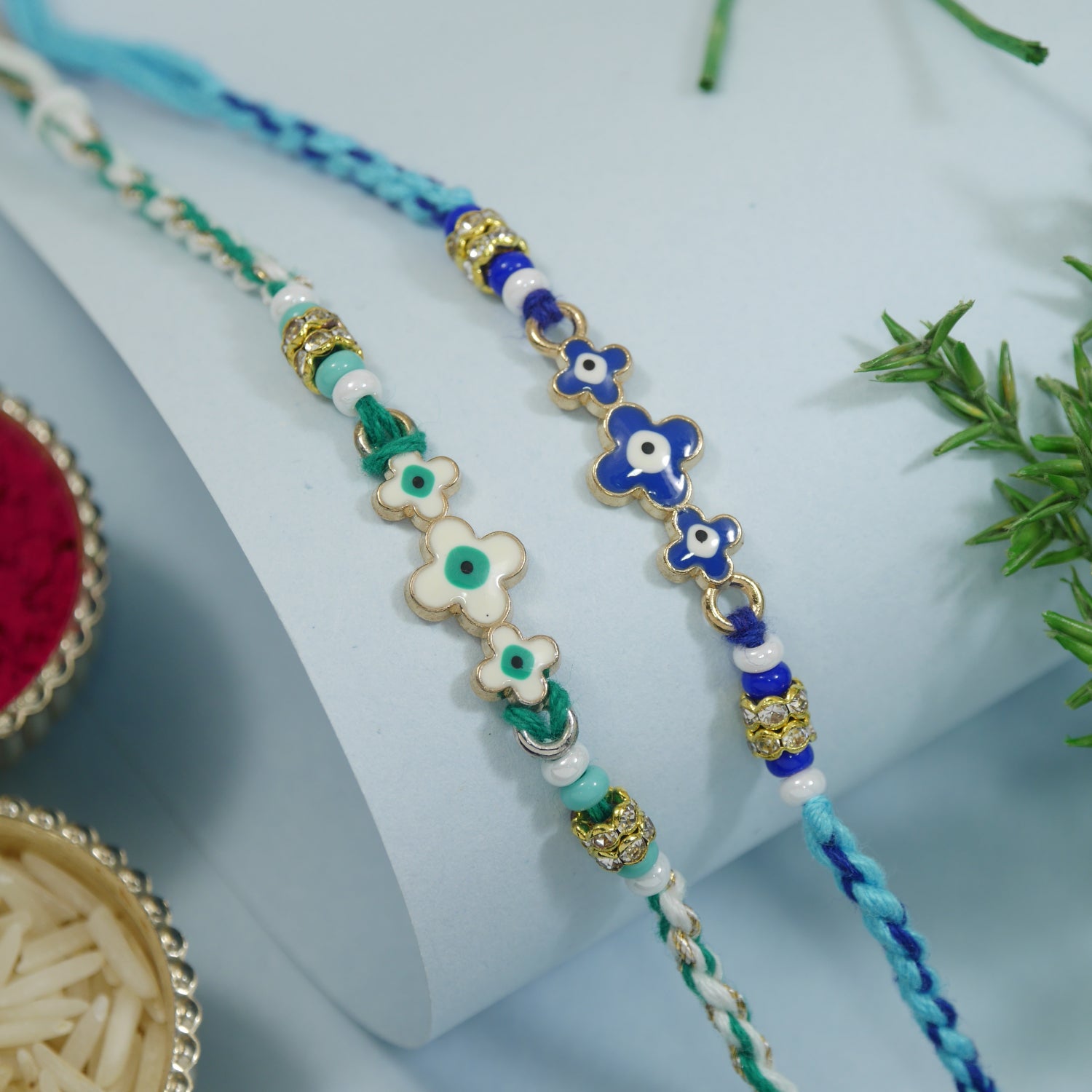 Minimalist Evil Eye Rakhis With Roli Chawal & Rakshabandhan Card (Pack of 2)