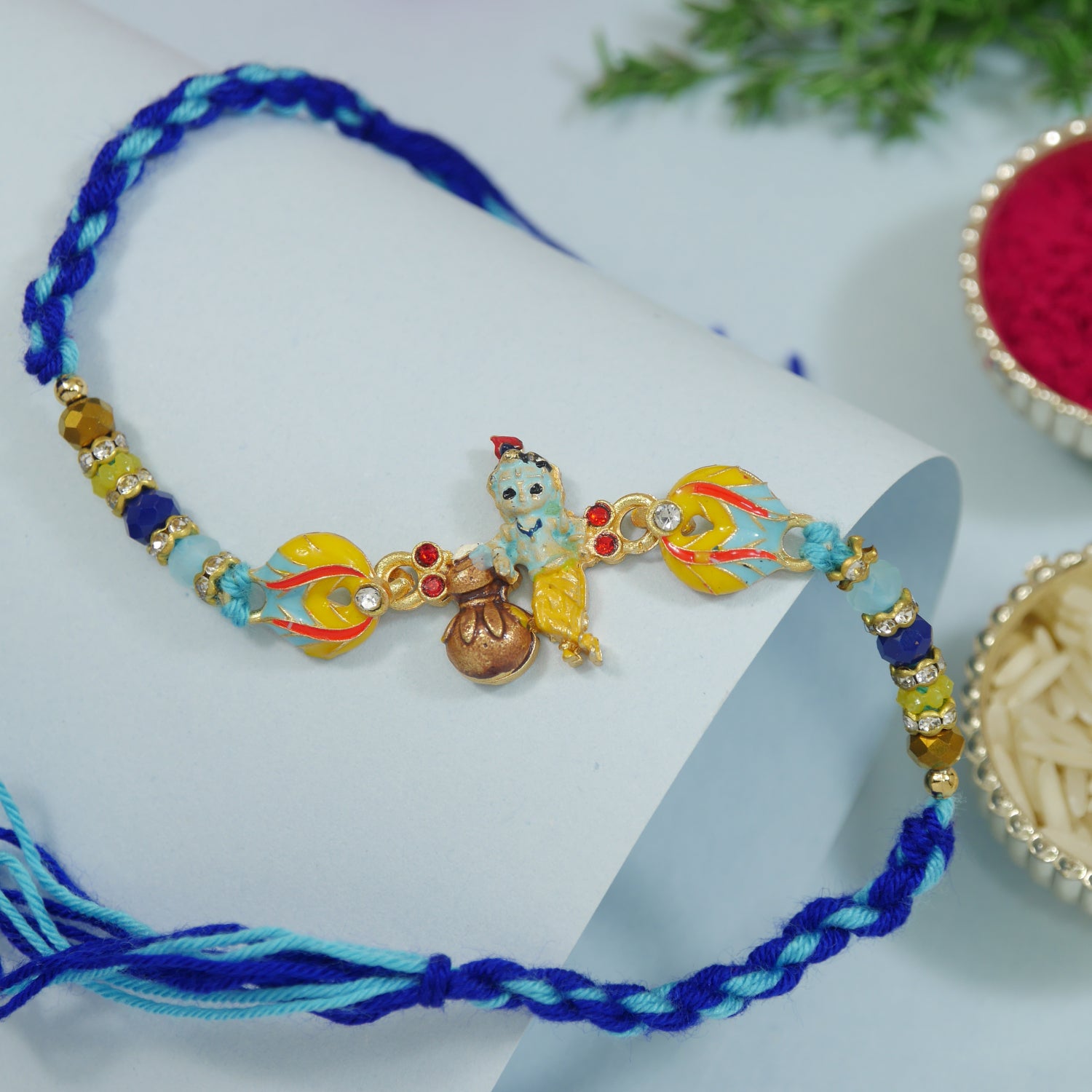 Adorable Little Krishna Matki Rakhi With Roli Chawal & Card