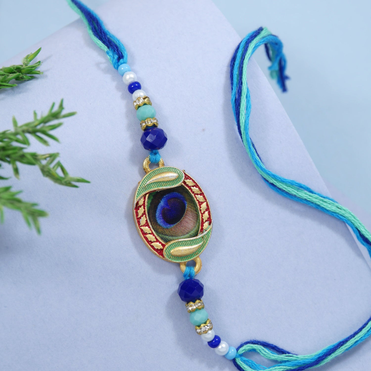 Elegant Peacock Feather Rakhi WITH ROLI CHAWAL & RAKSHABANDHAN CARD