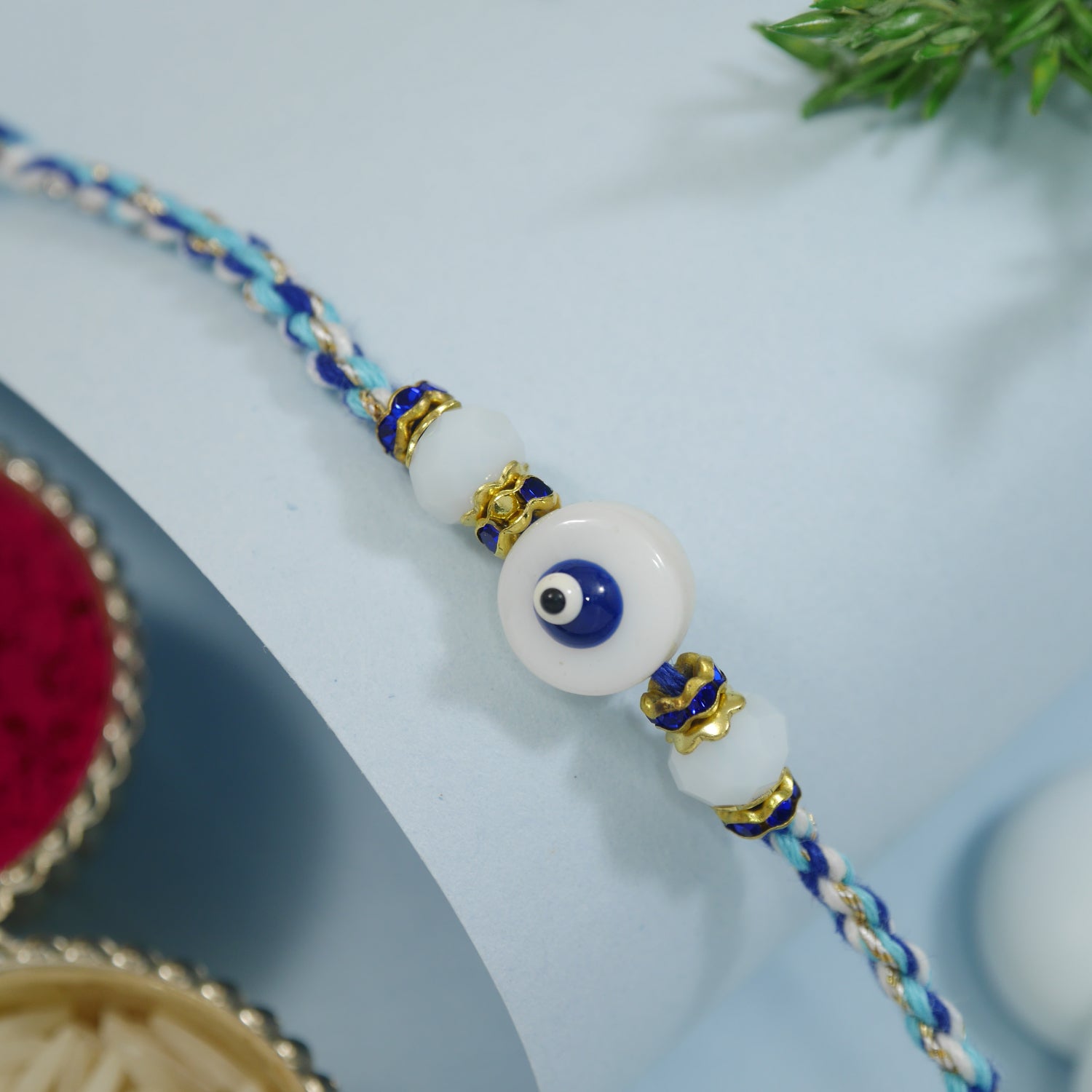 Elegance Blue Evil Eye Rakhi with Roli Chawal & Rakshabandhan Card