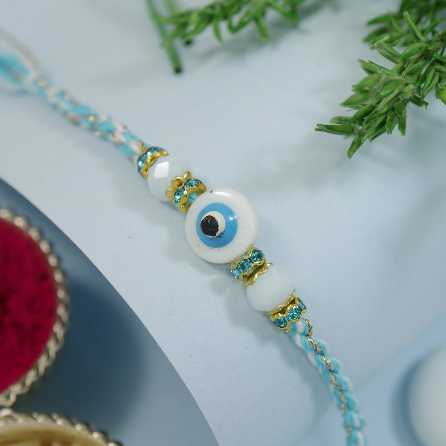 Elegance Turquoise Evil Eye Rakhi with Roli Chawal & Rakshabandhan Card