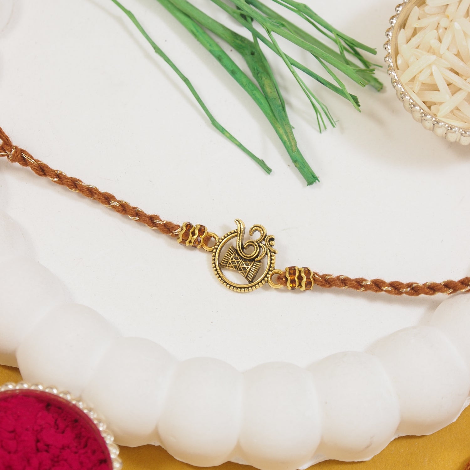 Om Pearl Damru Rakhi for Brother with Roli Chawal and Raksha Bandhan Card