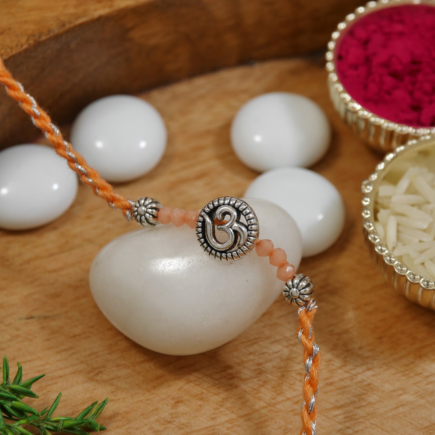 Elegant Om Rakhi with Orange Green Beads