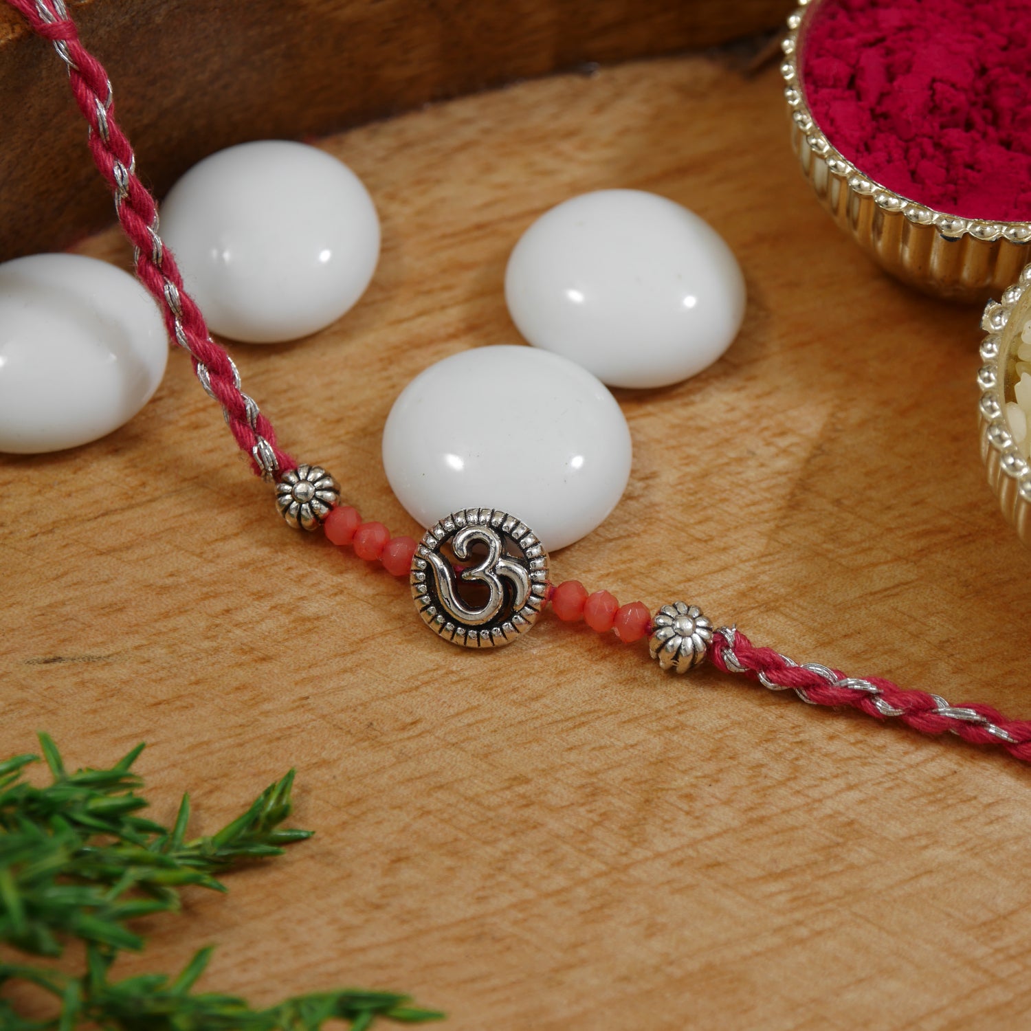 Elegant Om Rakhi with Pink Green Beads